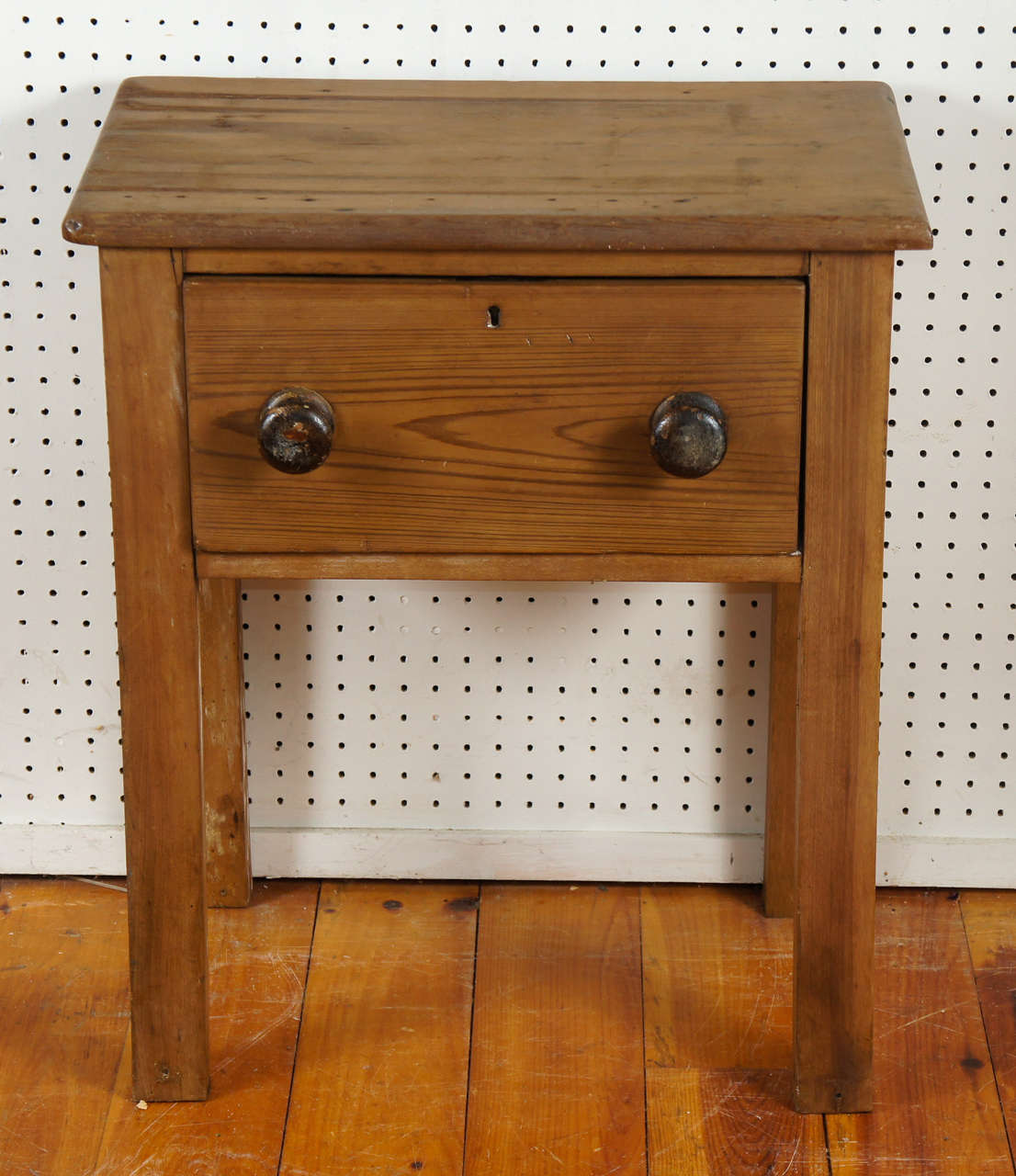 This sweet table would work either as an nightstand or a side table. One nice sized drawer with two brown knobs will hold anything you can think of for such a small table. Nice patina. A real country table.
