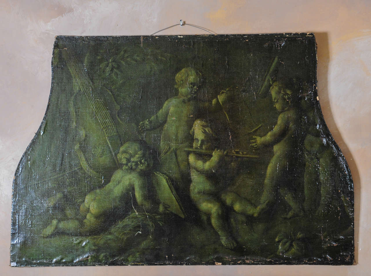 Trompe l'oeil painting of four putti making music, painted in green shades. Oil on canvas.