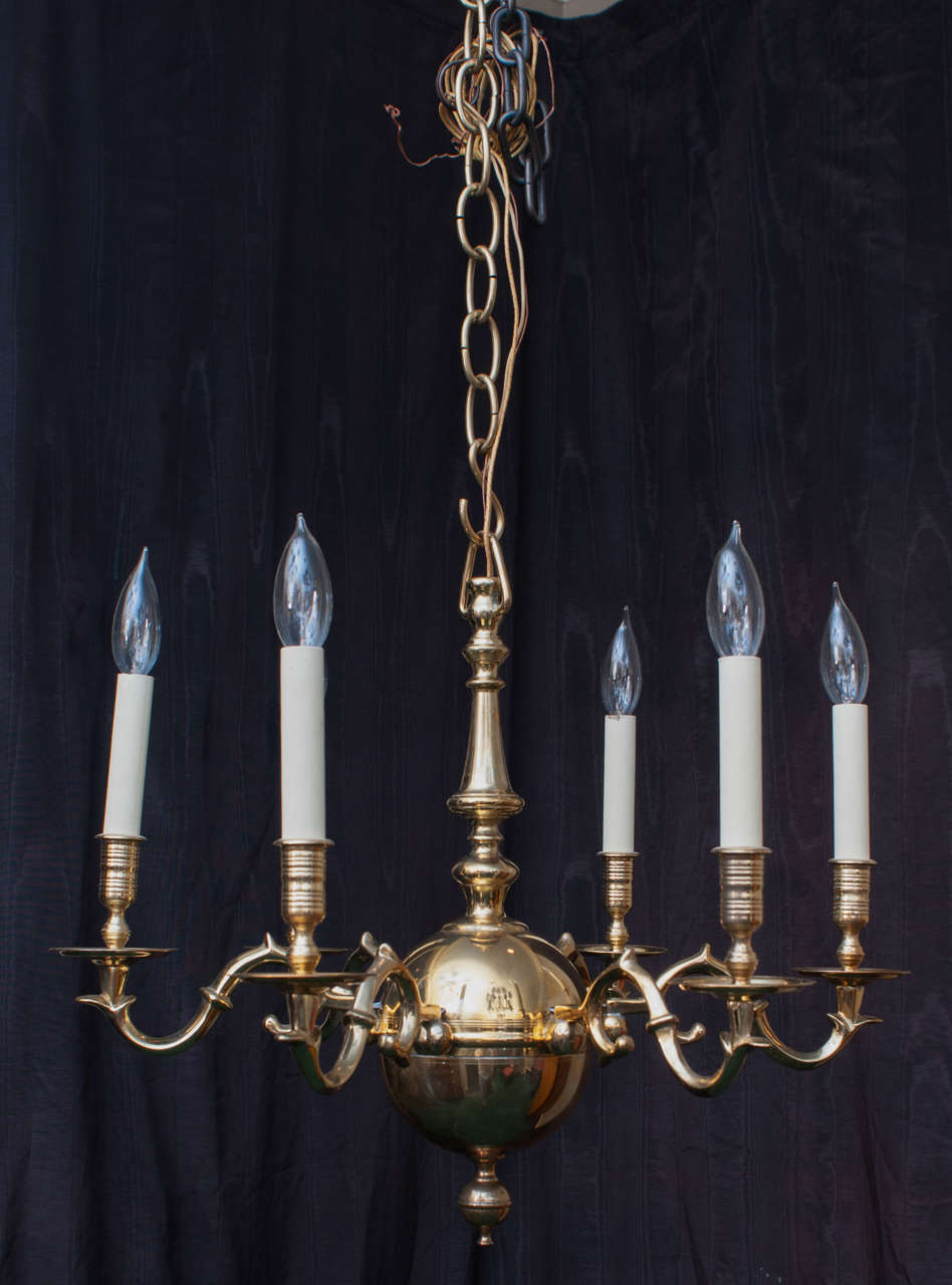 Hand-cast copy of an 18th Century Colonial American chandelier. Hanging hardware, ceiling cap and chain included.