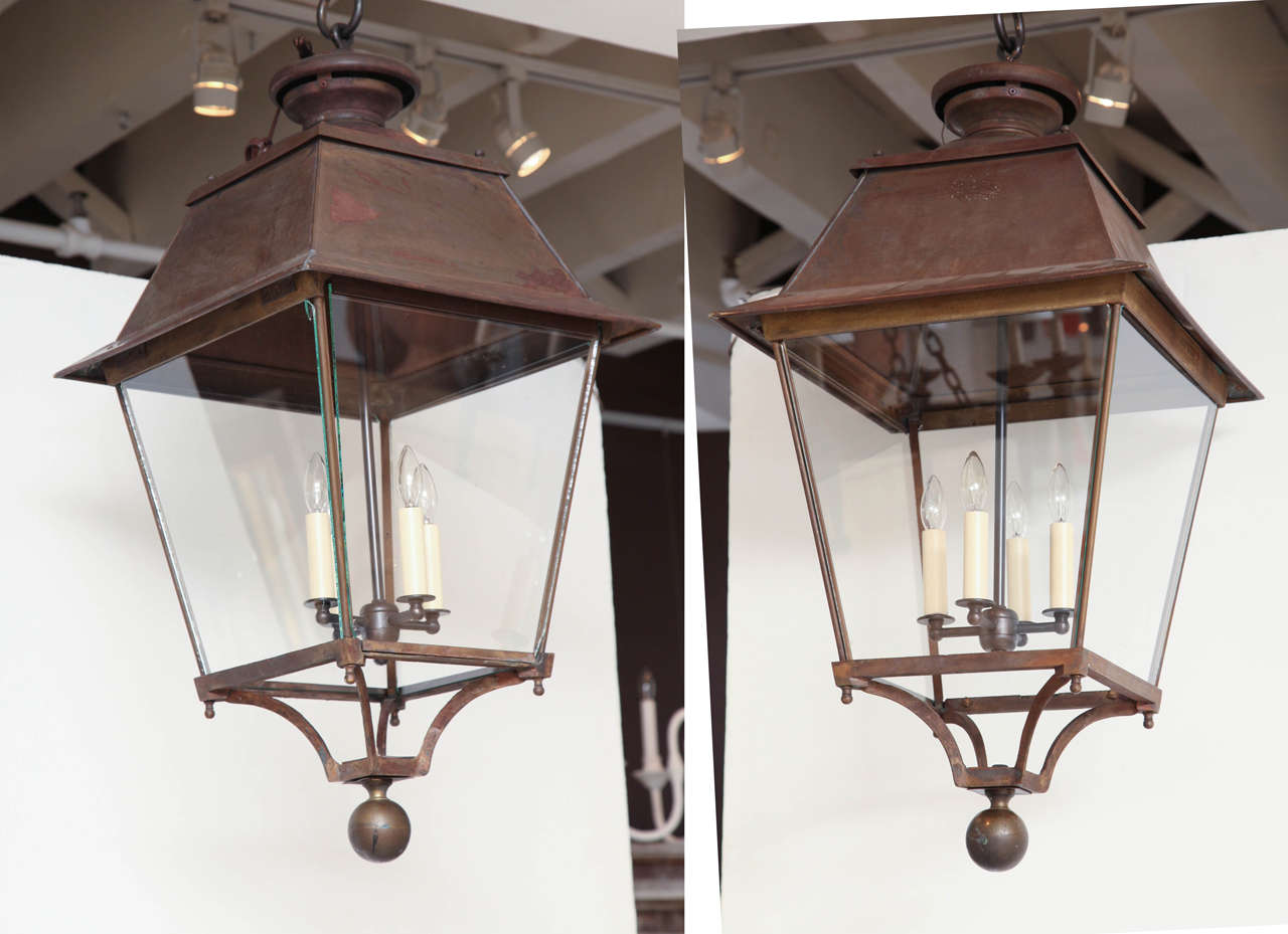Large square, tapering copper and glass lanterns with ball finial. 
Three available. Priced individually.