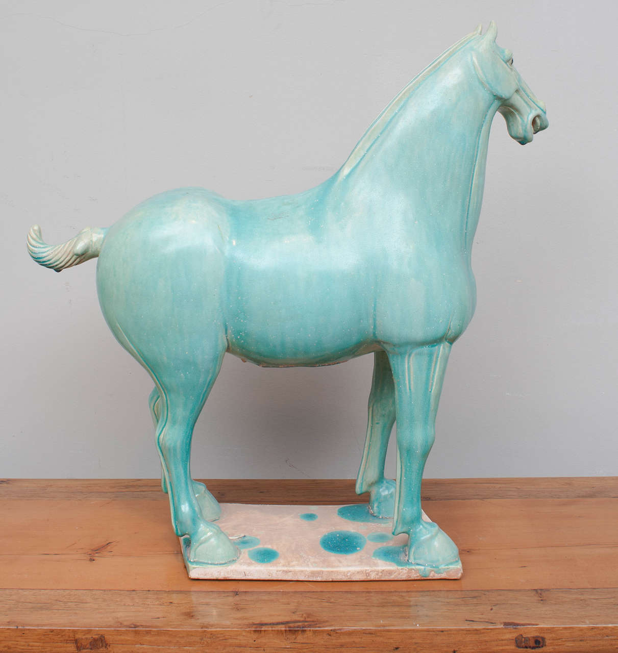 Reminiscent of Tang Dynasty artifacts, this expertly green glazed ceramic horse will enhance any interior.