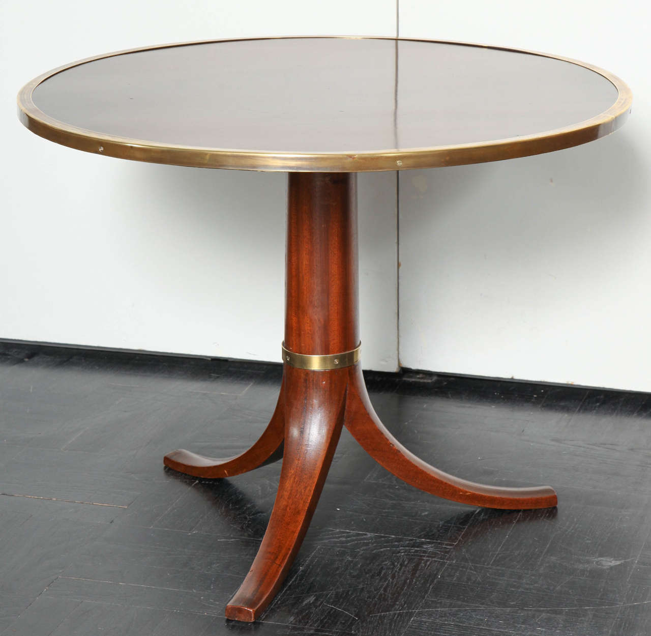 Mid-20th Century mahogany circular table, brass band edge, tripod legs