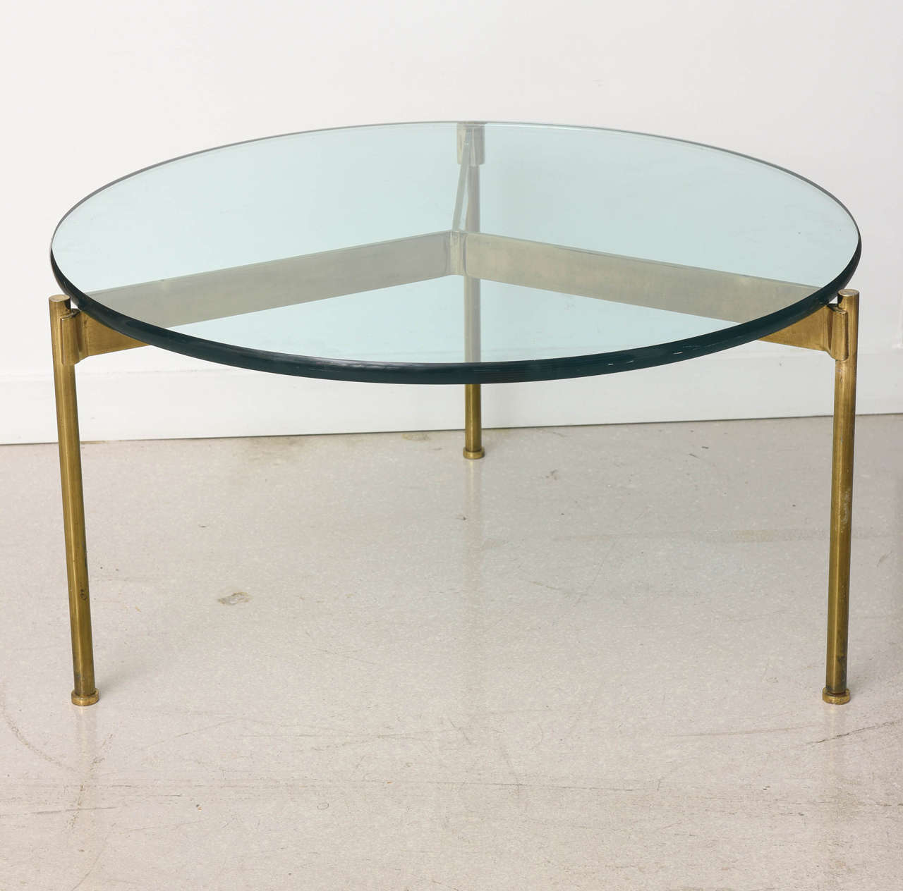 Vintage circular brass and glass coffee table by Ward Bennett.