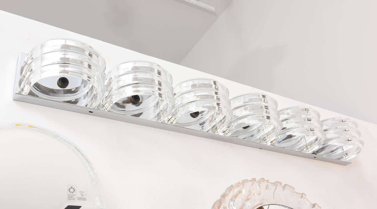 Long Lucite flush mount is perfect for over a vanity or can be mounted as an overhead fixture. It has six sockets.