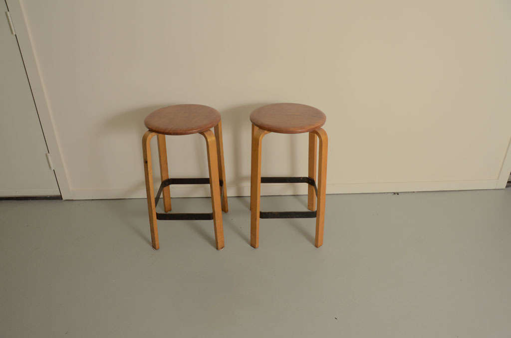 Vintage bentwood stools with steel foot rests.
