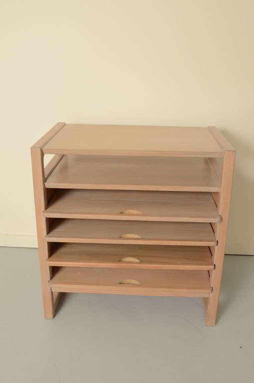 Magazine Table designed by Edward Wormley for Drexel Furniture's Precedent line. The table has five shelves, four which have handles and pull out. Marked Drexel Furniture Company on the bottom.