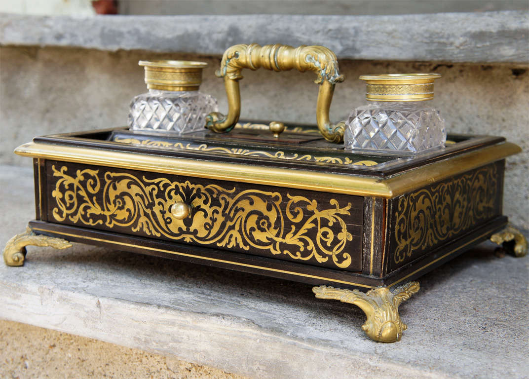 A Boulle style inlaid Ink-stand with two ink bottles with bronze lids, and bronze accent pieces