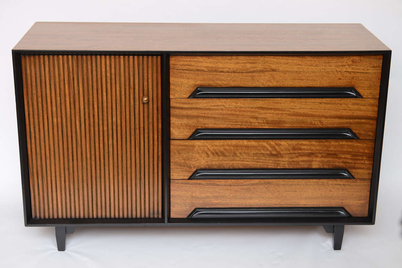 Exciting credenza, server or sideboard buffet. Milo Baughman designed in 1952, the Perspective Line for Drexel, exclusive to Bloomingdale's in New York. Featuring Primavera wood finishes with carved wood pulls incorporated in the body of the