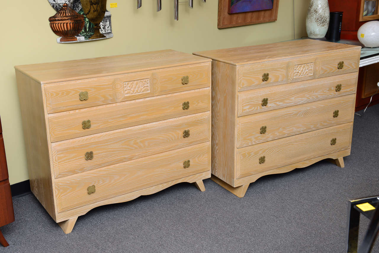 REDUCED FROM $2,850. EACH.
Beautiful cerused oak highlights this pair of 1940s dresser commodes by Jamestown Lounge Company. From their British oak line, they exhibit a smart Hollywood cottage genre with nods to Arts & Crafts stylings. The chamfered