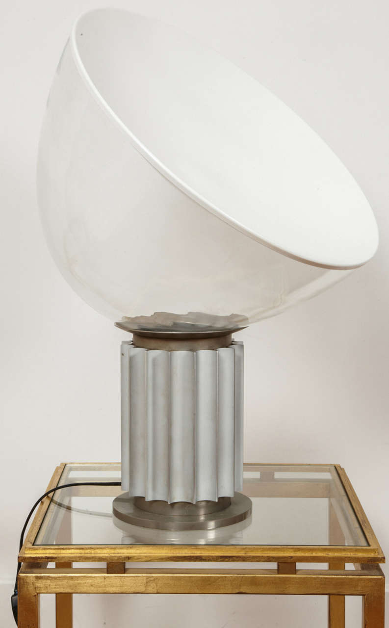 Taccia table lamp with an half sphere reflector and canneled base, by Pier Giacomo and Achille Castiglioni for Flos, 1962.
