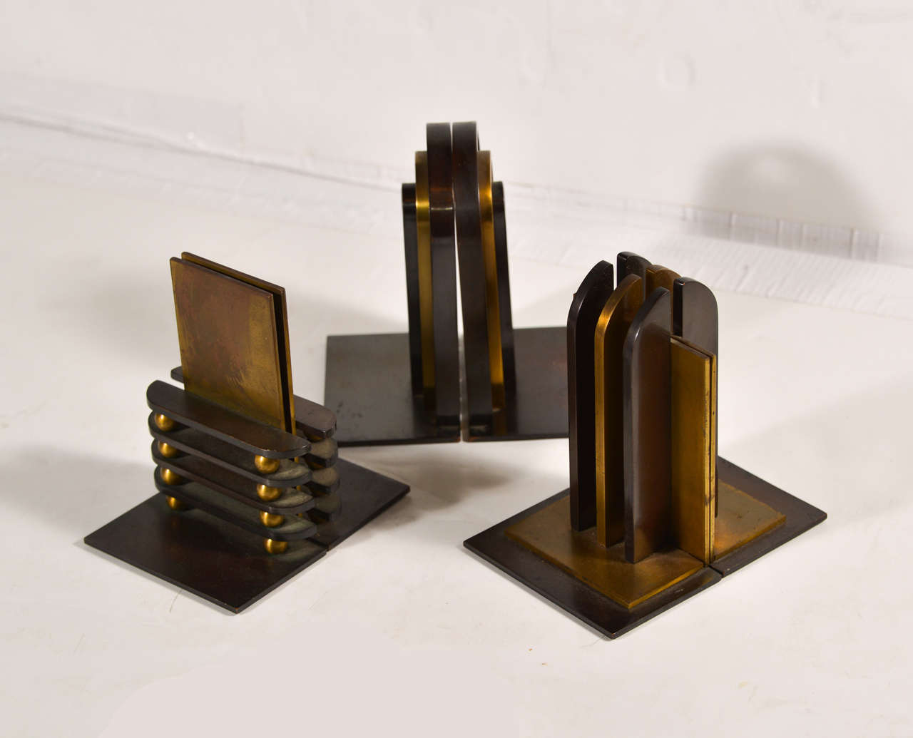 Collection of 3 pairs early Nessen art deco designs for Chase, ca 1933.  Patinated antique brass and English bronze.  Original condition, unpolished .

SOLD Rare Octaball  OCTABALL HAVE BEEN SOLD
Classic Gothic
SOLD Stepped Arch  SOLD

PRICED