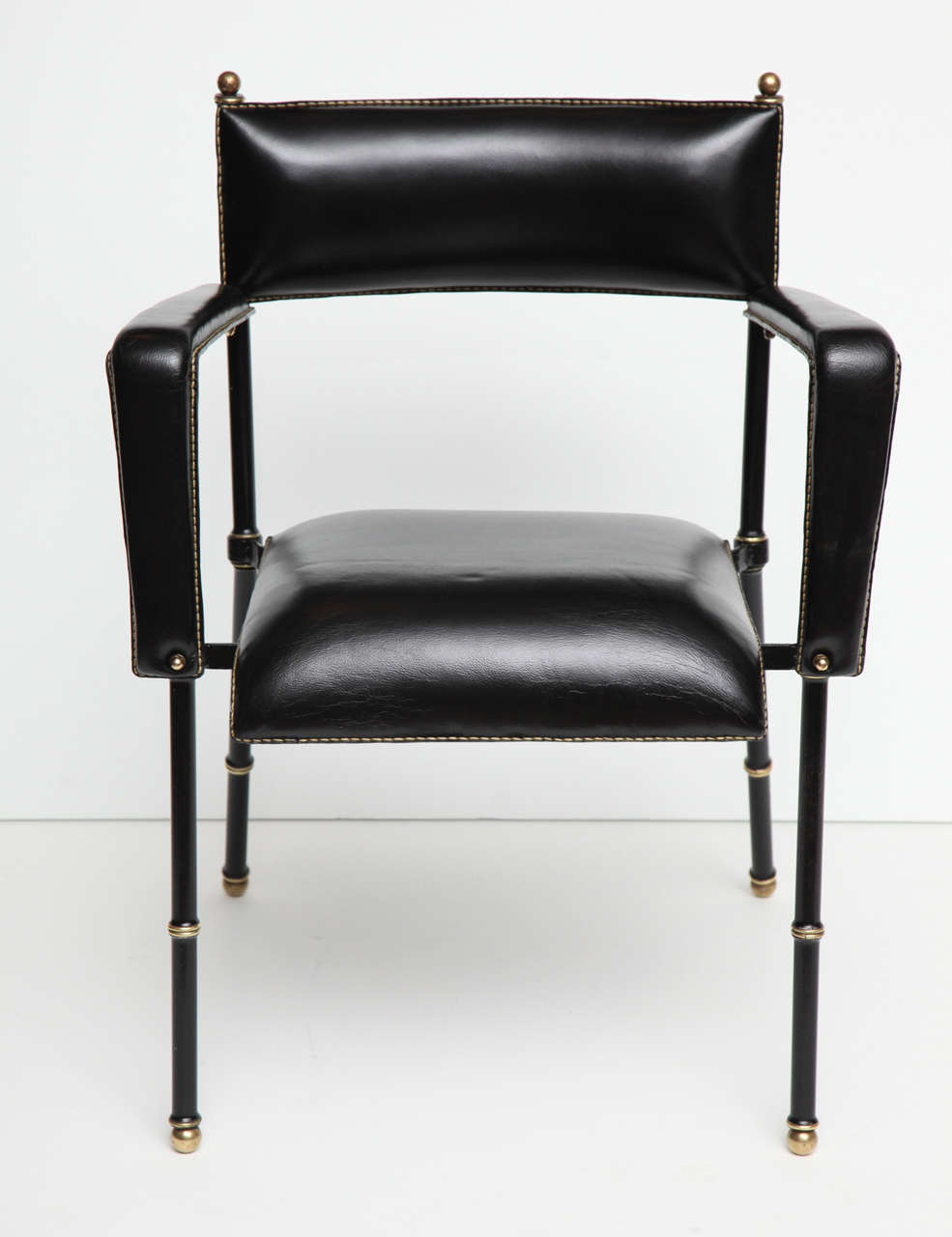 Set of four black leather armchairs by Jacques Adnet

* Can also be purchased individually