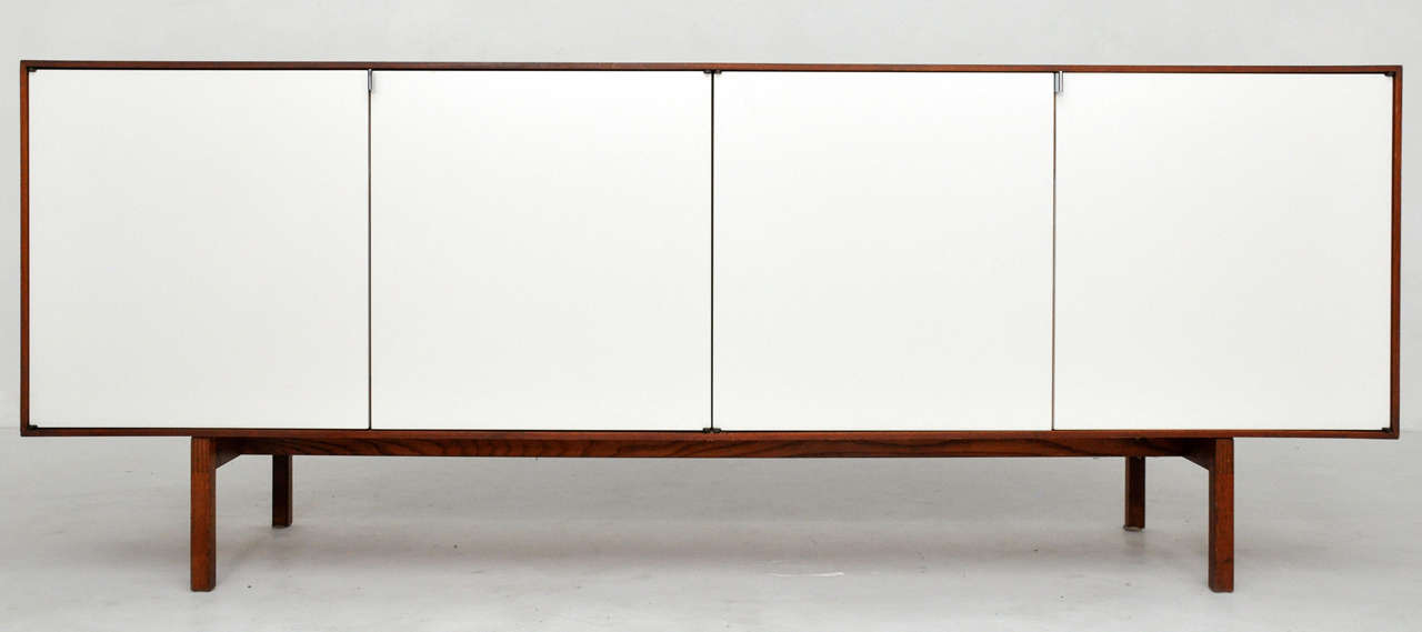 Florence Knoll sideboard.  Walnut case with satin white lacquer doors.