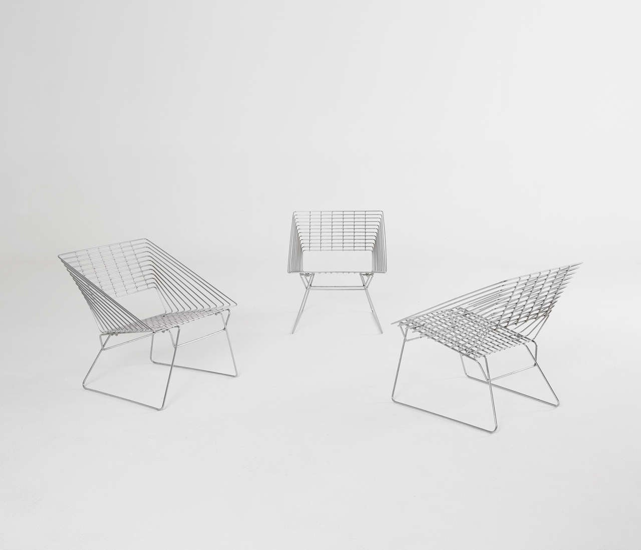 Set of three chrome wire easy chairs attributed to Verner Panton by Fritz Hansen 1970's.

A very nice square design lounge chair with a nice ratio between the seat and the base. The wires are spaced perfectly and the chrome is in a perfect