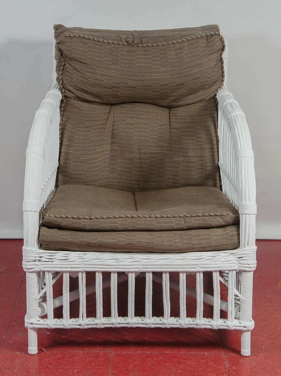 This armed rattan, split reed and wicker chair advertises deep-seated comfort.
Back, 30.25