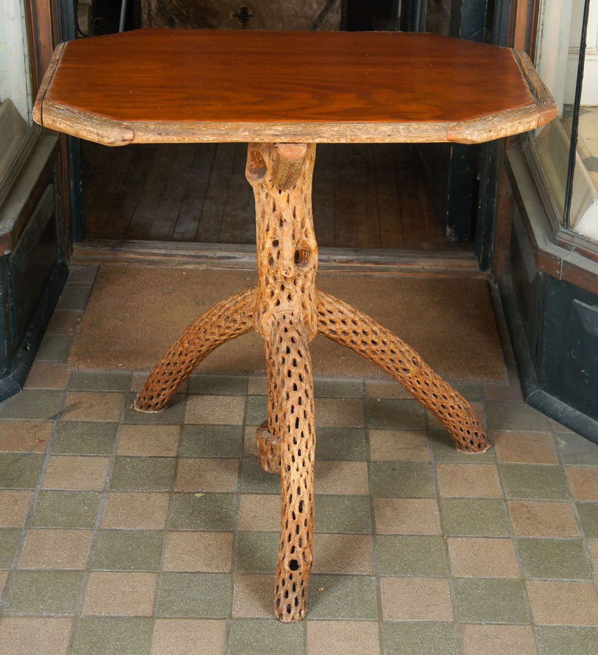 This interesting and unusual table made in the southwest circa 1930 is constructed of Saguaro wood, a kind of slow-growing dense cactus with a distinctive outer casing that is used for decorative display. The form is an extension of the mission