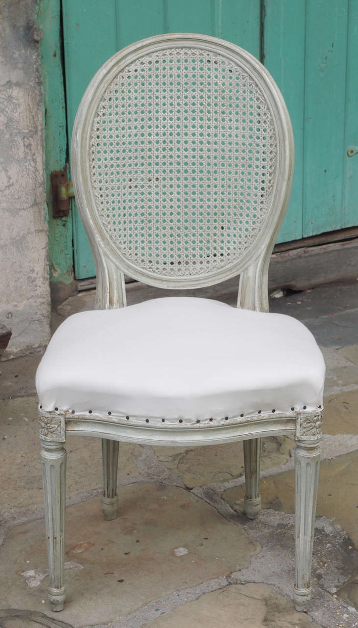 Eight 19th Century French Painted Dining Chairs with Cane Backs