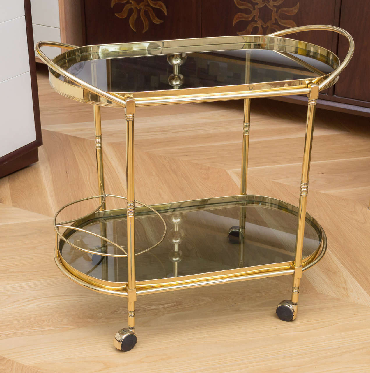 Polished  brass Italian bar cart with smoked glass.