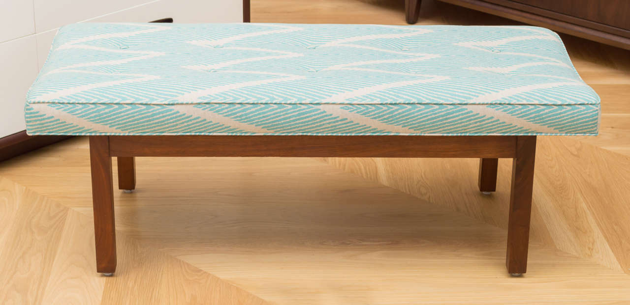 Simple straight forward walnut bench, in a printed linen fabric.