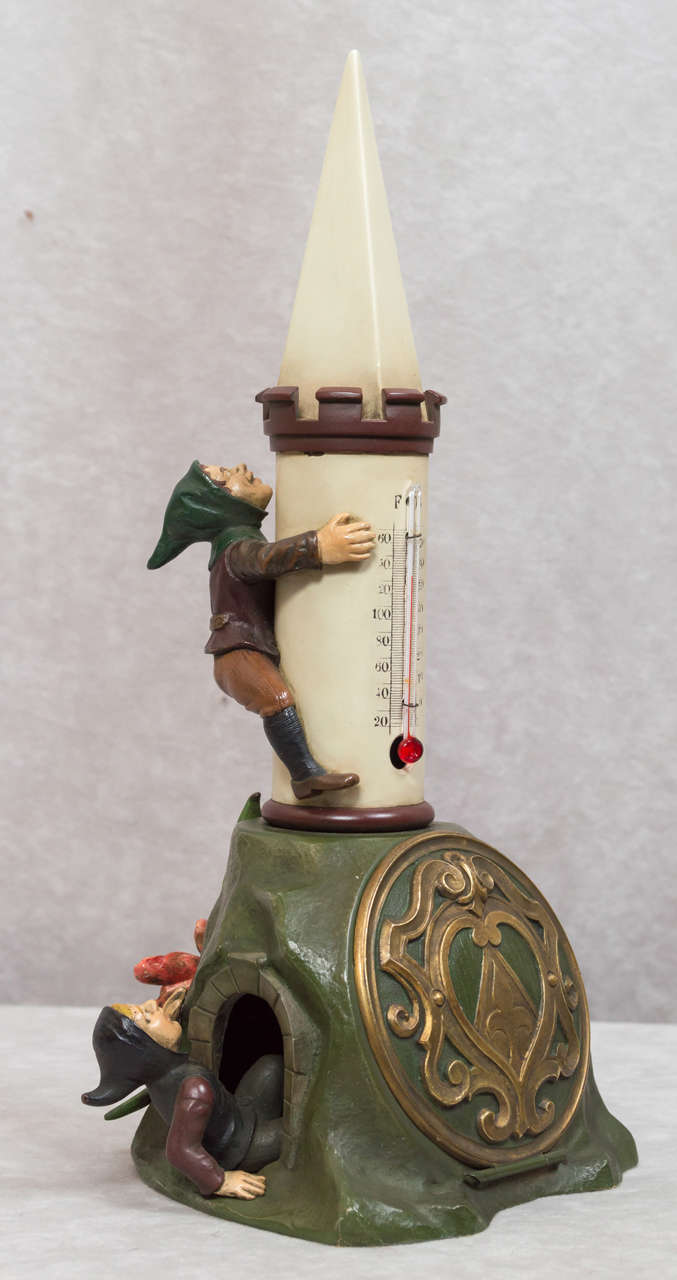 It would be quite hard to look at this bronze and not smile. These funny little elves are having quite a time. There also is a little lizard checking things out. In case you want to know what the temperature is, you can look at the thermometer. The