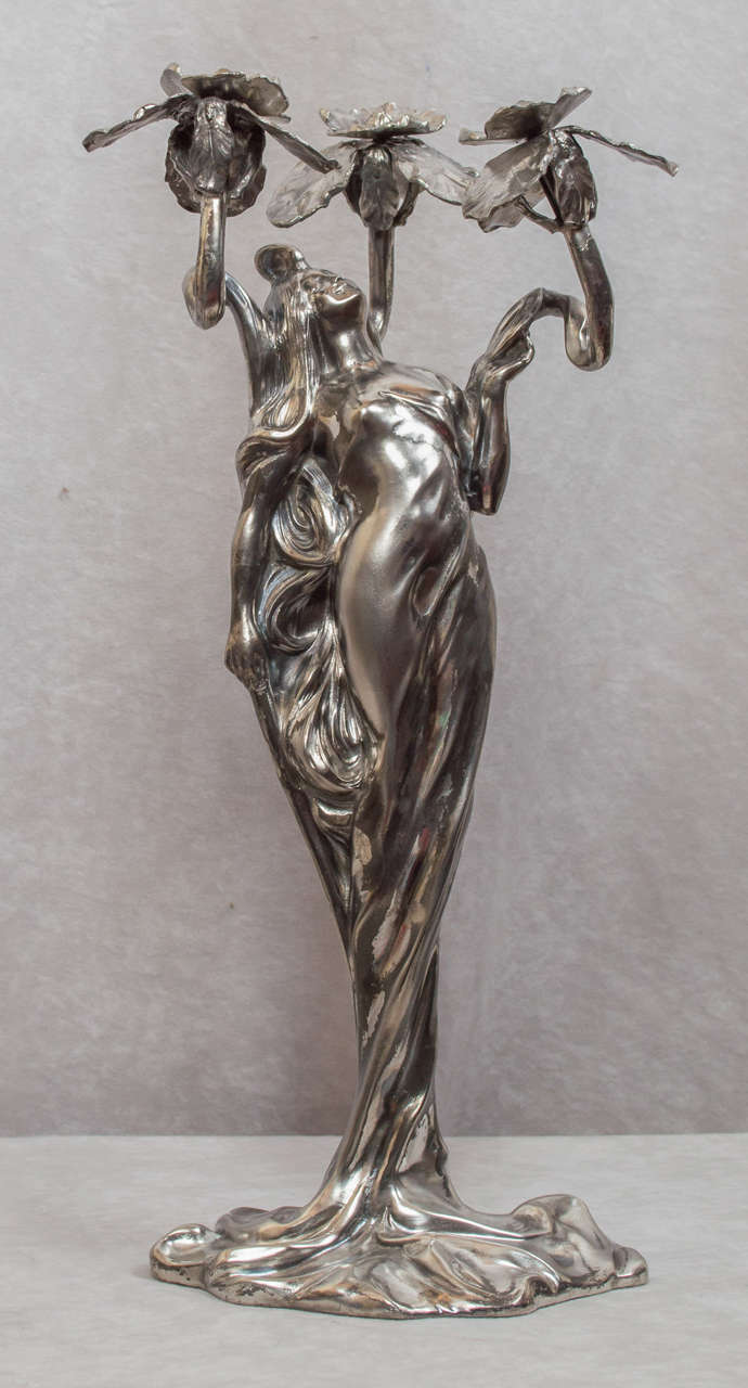 This very sinewy and nature loving maiden is a nice example of the work of Claude Bonnefond. The statue is signed by artist, who was French and worked during the Art Nouveau period. It is silver plated metal. A very nice addition to any Art Nouveau