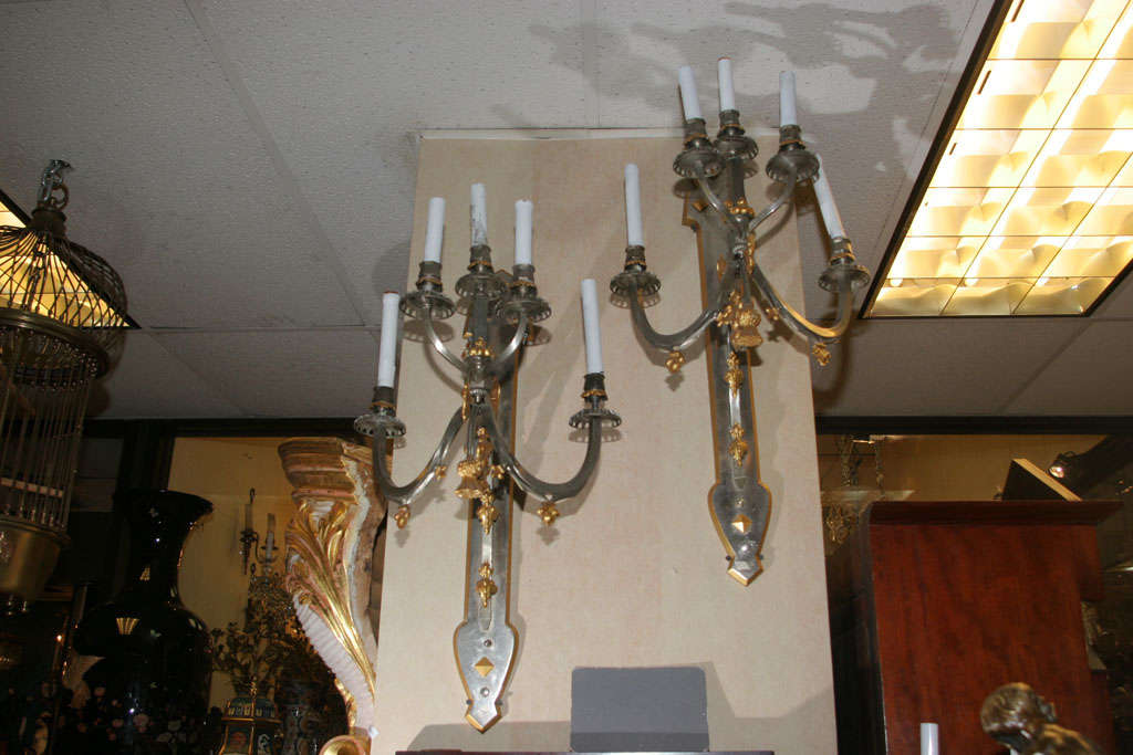 This fabulous pair of sconces features a mixture of traditional and gothic styles, culminating in a highly decorative and attractive pair.
Stock Number: L82.