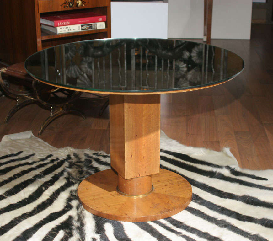 Jules Leleu (1883-1961).

A modernist French Art Deco mirrored table, created circa 1936. In sycamore, with gilt bronze accents. Signed and referenced in "Mobilier et Decoration" 1937, pg. 335, "Meubles et decors des annees 40"