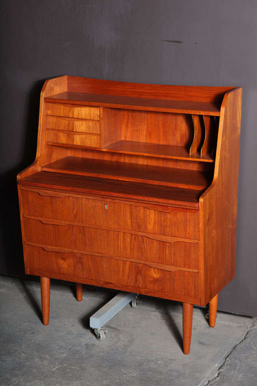 Danish Modern Teak Secretary with 3 Dresser Drawers.  Features a compact frame with plenty of storage, pull-out desk, open shelves and cubbies, and miniature drawers.