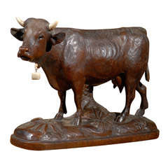 Used Carved Black Forest Cow on Base