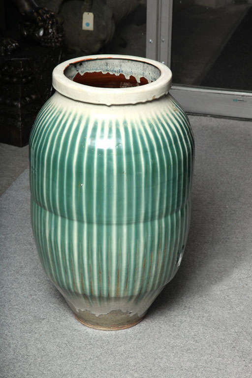 A classic 1870s large Japanese Shigaraki celadon glazed ceramic jar from the late Edo or early Meiji period. This exquisite celadon glazed ceramic storage vessel was made in the Shigaraki kilns of Japan in the second half of the 19th century, during