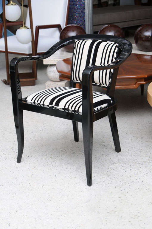The black lacquer frame with an upholstered seat and back.