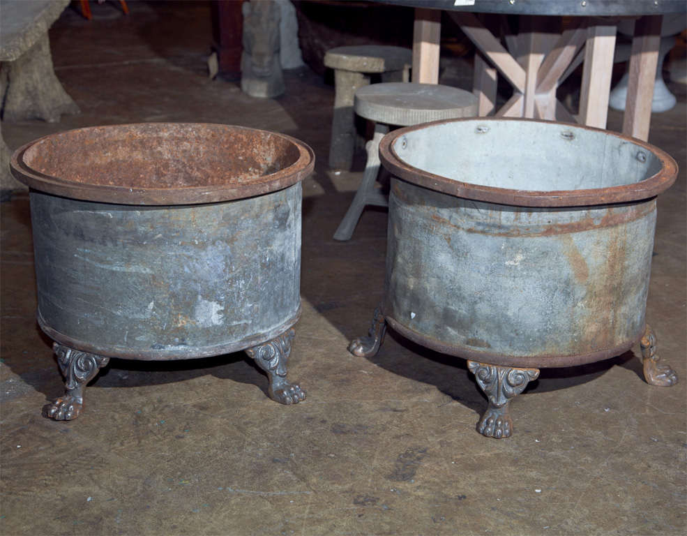 Belgian footed zinc jardiniere, 20th c., the tub of zinc with iron banding top and bottom, on cast iron feet. It would also make a great coffee table with a stone or glass top. One available.