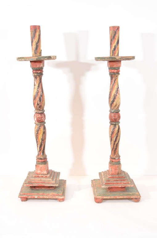 Pair of wood carved, painted twist alters candlesticks.