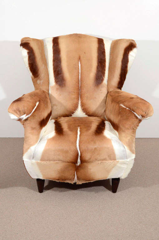 Hilltop wing chairs with plump conical feet, newly upholstered in springbok fur.