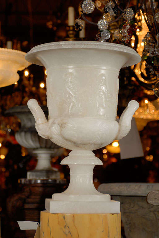 Carved Pair of Pedestals with Urns For Sale