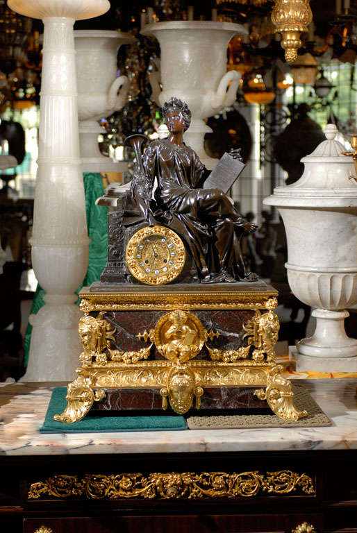 Exquisite figural Louis Phillipe style clock with Rosso Levante marble base with gilt and patinated bronze