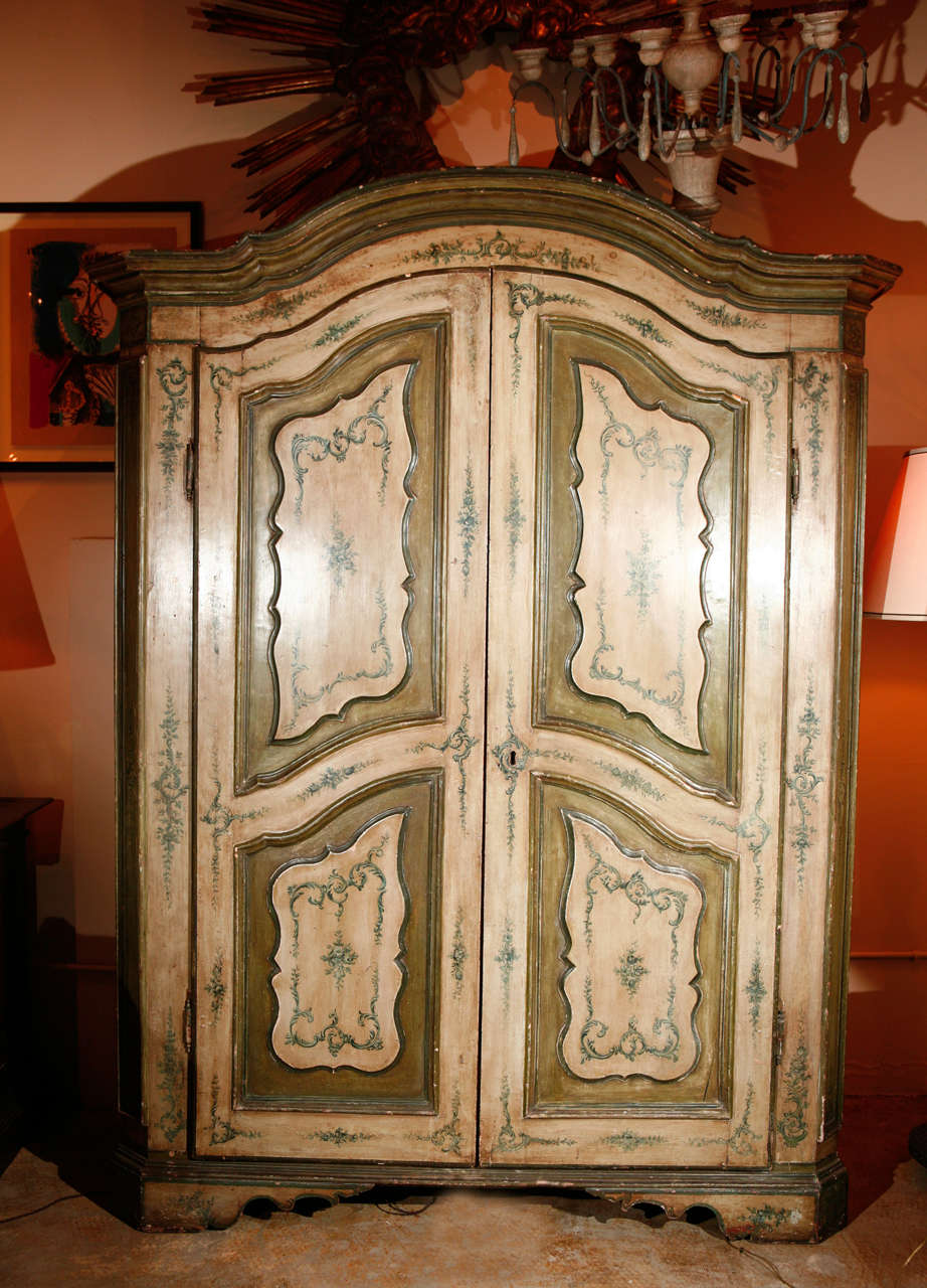 Hand painted, pale green and blue armoire with beveled corners and large, interior drawer.