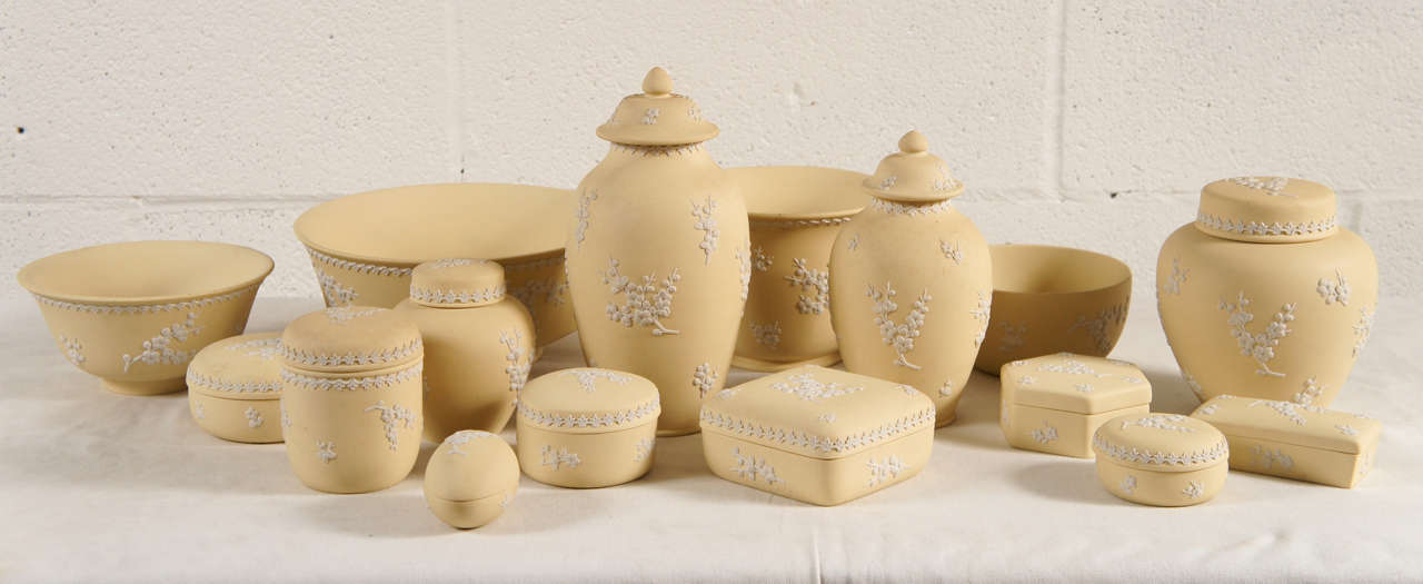 Here is a beautiful collection of Wedgewood in a pale yellow color with white detail. There are sixteen pieces in this group.