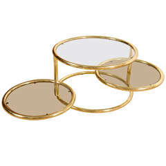 A Brass Three Ring Cocktail Table