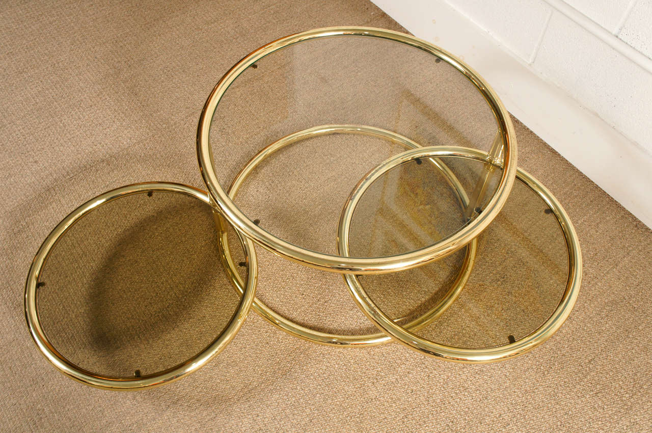 A Brass Three Ring Cocktail Table In Good Condition In Hudson, NY
