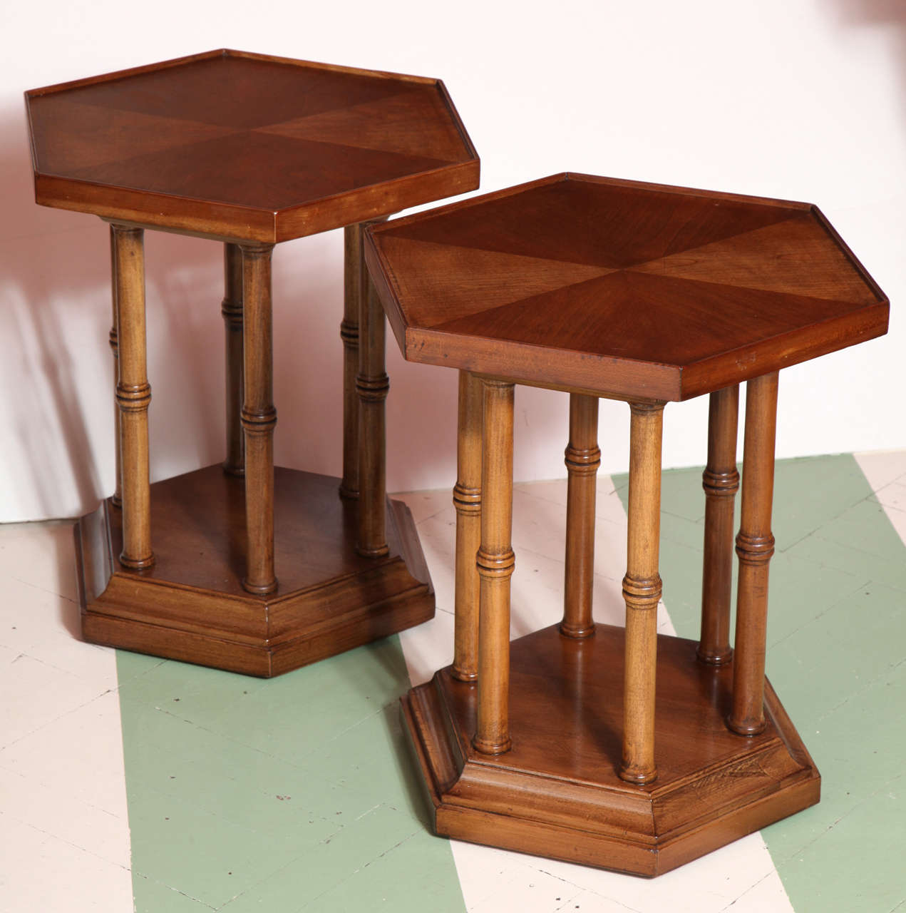A pair of 1960s faux bamboo hexagonal Brandt drinks tables. The hexagonal top of each table features a matched parquet pattern.
