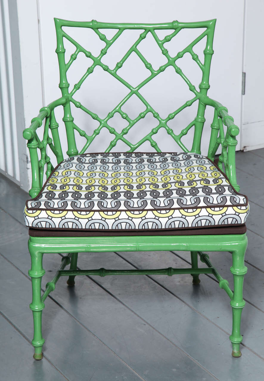 A set of six newly restored Phyllis Morris Chinese Chippendale cast metal garden chairs. The chairs have a new apple green powder coated finish and new platform-style seats with removable cushions fashioned from Trina Turk outdoor fabric. Dimensions