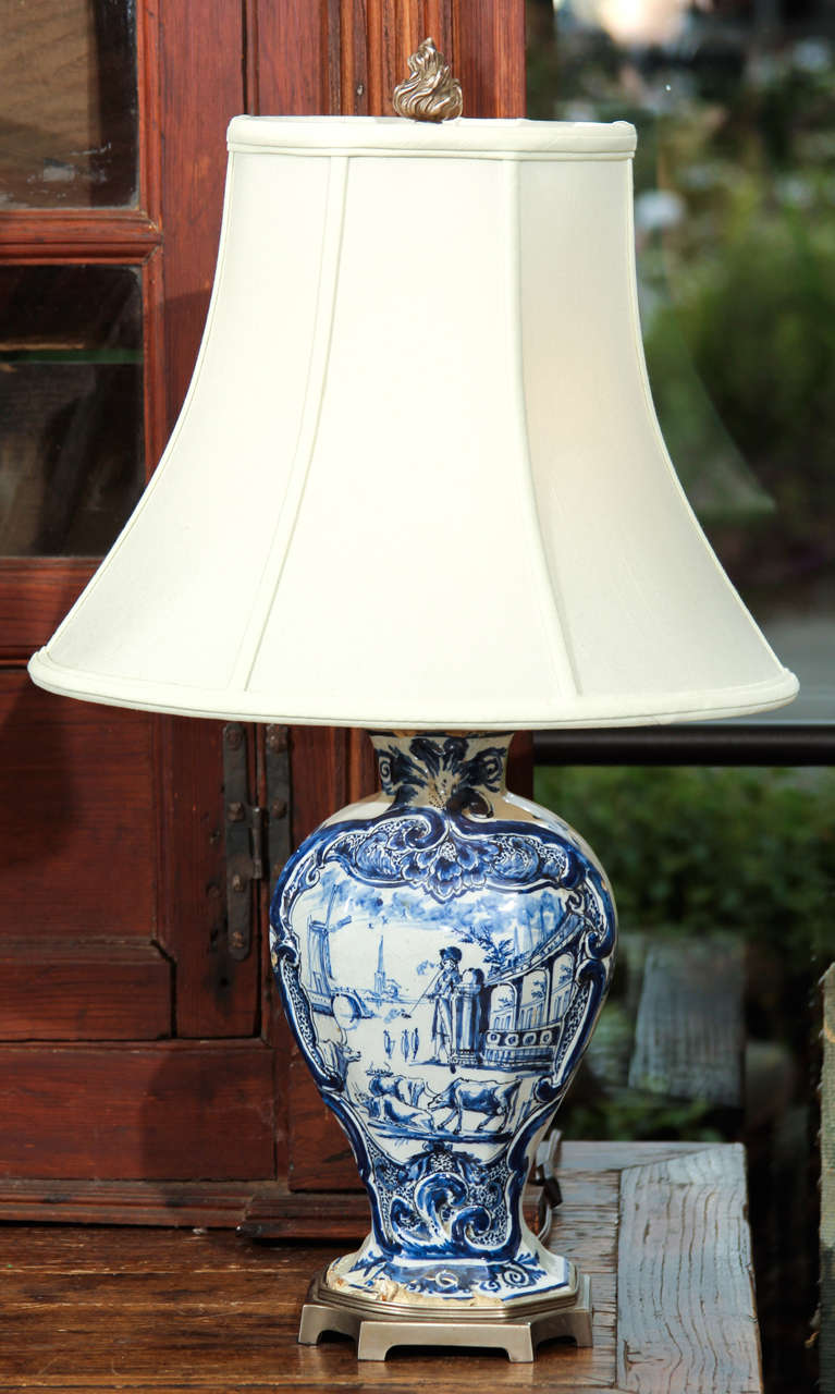 An 18th century Delft vase fitted out as a lamp in the early 20th century. 