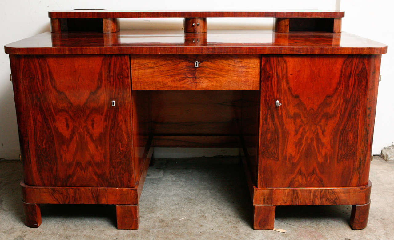 Hungarian Art Deco walnut burl veneer desk with gallery.