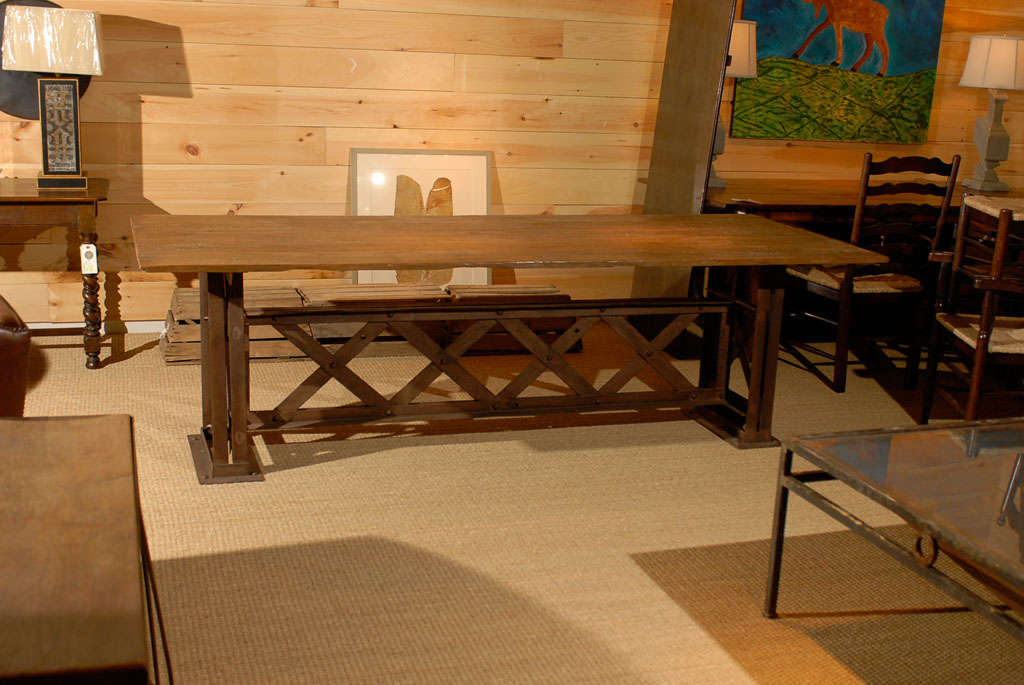 Reclaimed Iron Trestle Table with Reclaimed Floor Boards