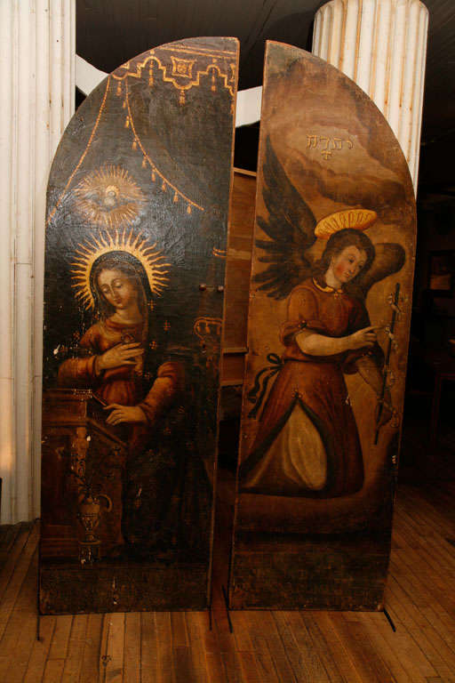 Pair Continental Renaissance Polychrome Decorated Doors<br />
Annunciation Scene flanks The Angel Gabriel<br />
back of doors in faux stonework tracery<br />
vestiges of wrought iron hardware<br />
stored in a corporate collection for twenty
