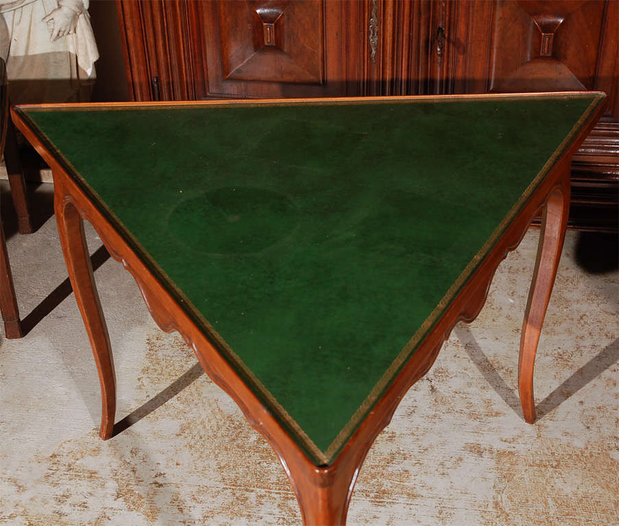 French, walnut, triangle occasional table with embossed leather top.