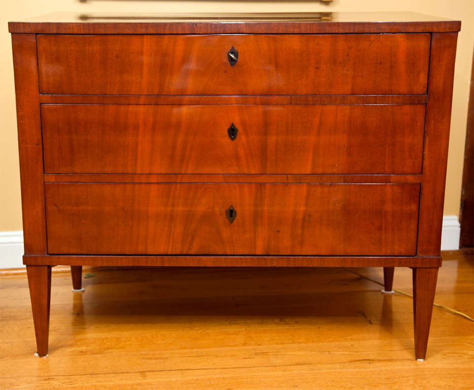 Modern looking Biedermeier chest of three drawers in mahogany on pine with ebony inlaid shield escutcheons, Germany, recently French polished, note fine quality of wood