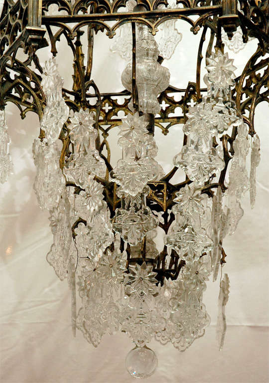Large cast brass and molded crystal chandelier. Eleven lights.