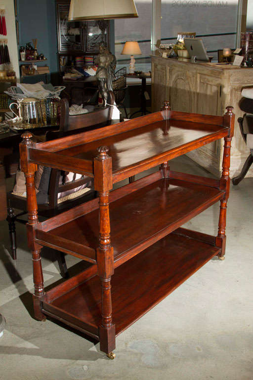 Antique Butlers cart on casters.